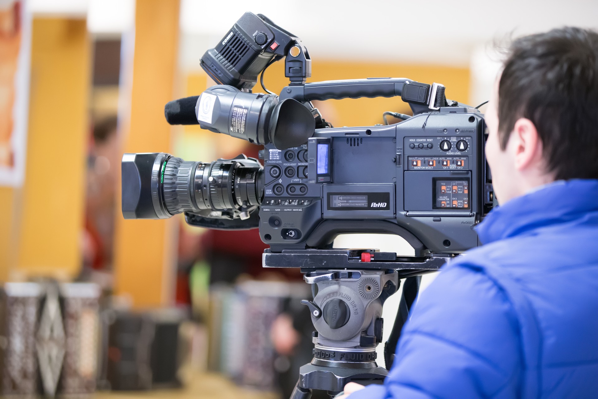 Male cameraman in a television studio. Video Operator