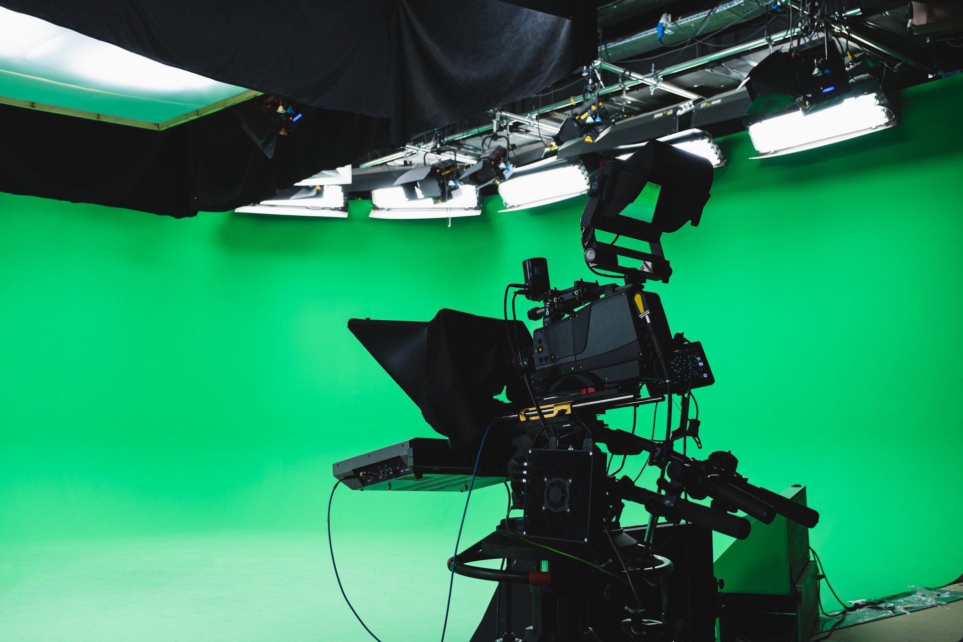 Professional green box tv studio. Prompter camera and studio lights ready for TV show. Tv industry.